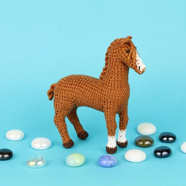 Brown Horse Amigurumi side view over blue background