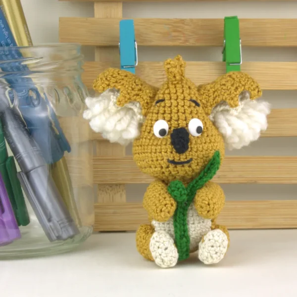 Mofli Koala Crochet Amigurumi on wooden background