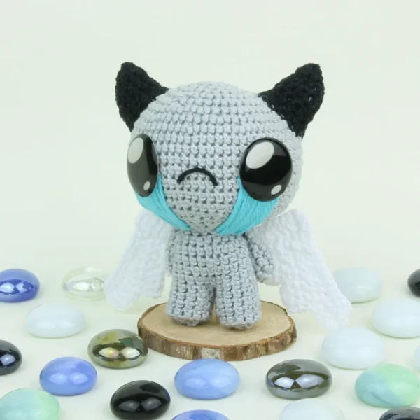 Binding of Isaac Apollyon Crochet Amigurumi surrounded by pearls