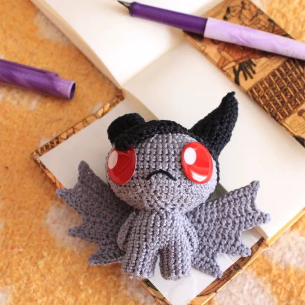 The Binding of Isaac Azazel Crochet Amigurumi on desk