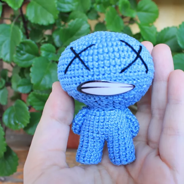 Binding of Isaac Blue Baby Crochet Amigurumi on holding hand