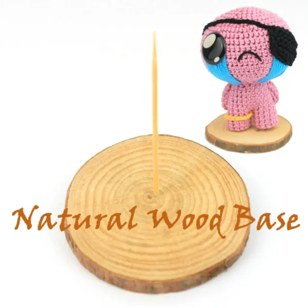 Binding of Isaac Cain Crochet Amigurumi and natural wood base over white background