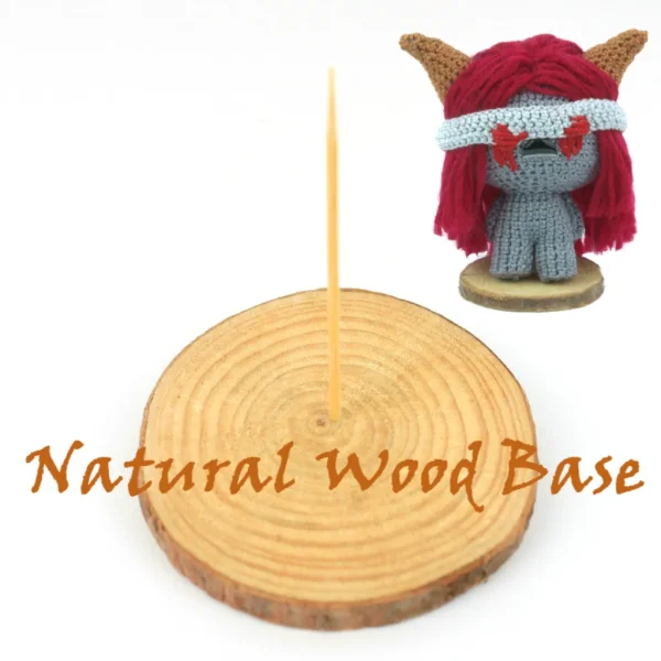 Binding of Isaac Lilith Crochet Amigurumi and natural wood base over white background