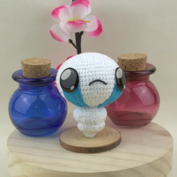 Binding of Isaac The Lost Crochet Amigurumi next to health and mana potions