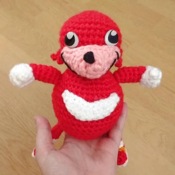 Ugandan Knuckles XL Crochet Amigurumi on holding hand