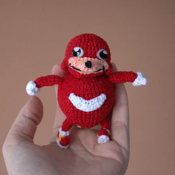 Red Ugandan Knuckles Handmade Crochet Amigurumi on holding hand