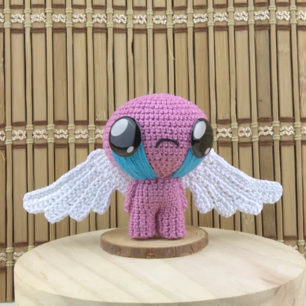 Winged Isaac Crochet Amigurumi front view over wooden background