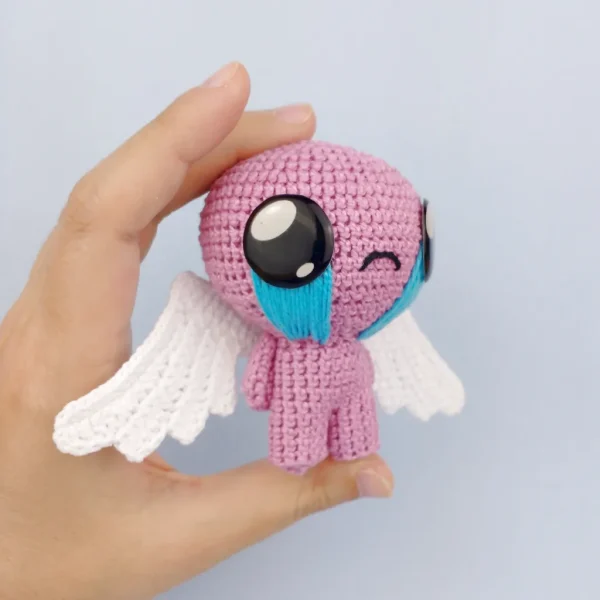 Winged Isaac Crochet Amigurumi on holding hand