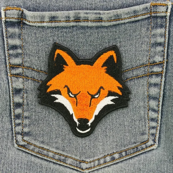 Orange Fox Head Embroidered Patch on Black Jeans