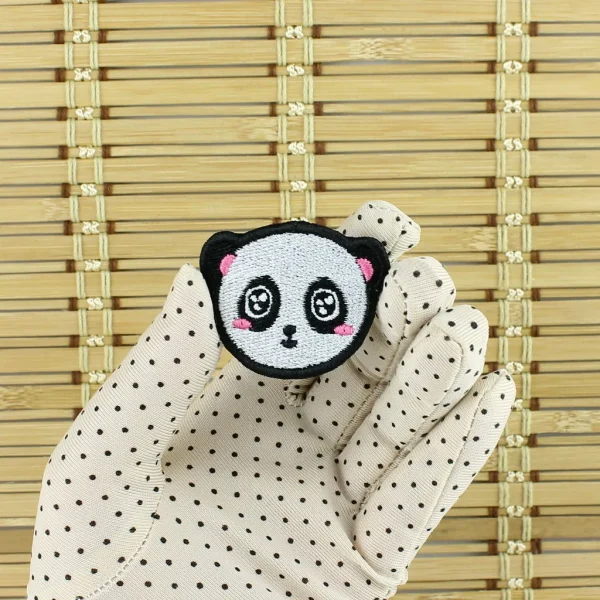 Kawaii Panda Embroidered Patch on holding hand