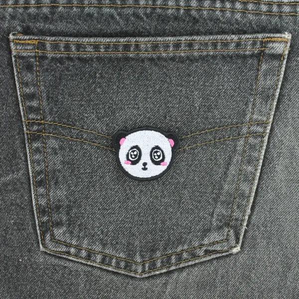 Kawaii Panda Embroidered Patch on black jeans