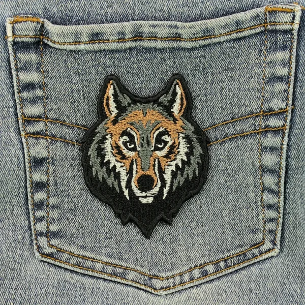 Wolf Head Embroidered Patch on black jeans