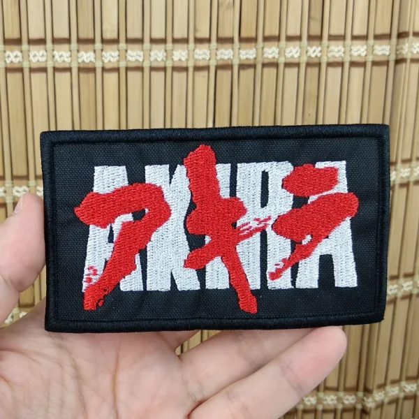 AKIRA Logo Embroidered Patch on holding hand