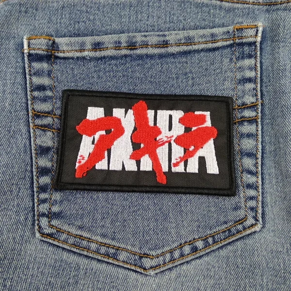 AKIRA Logo Embroidered Patch in Red Black and White on Jeans