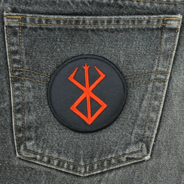 medium Berserk Logo Embroidered Patch on black jeans