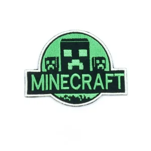 Green and Black Creeper Embroidered Patch over white background