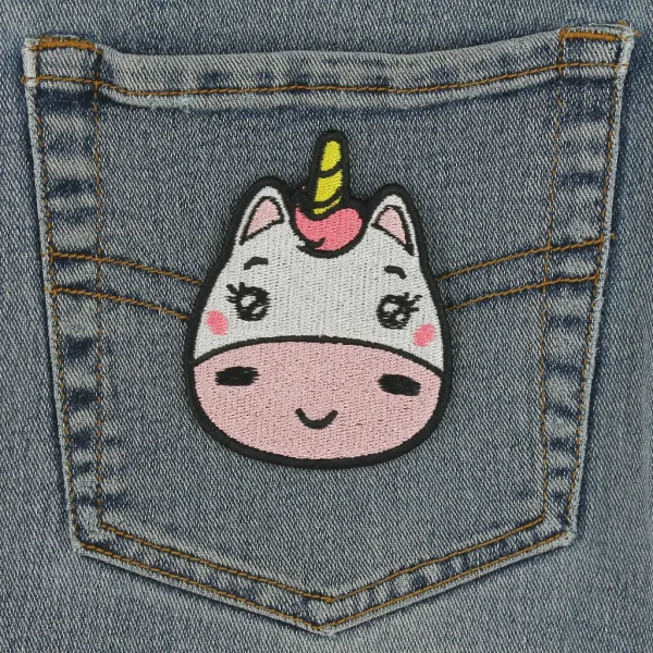 Medium White and Pink Kawaii Unicorn Embroidered Patch on black jeans