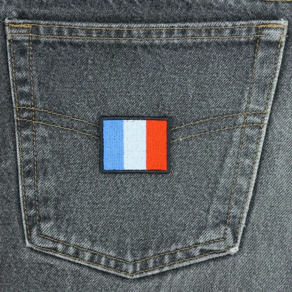 France Flag Embroidered Patch on black jeans