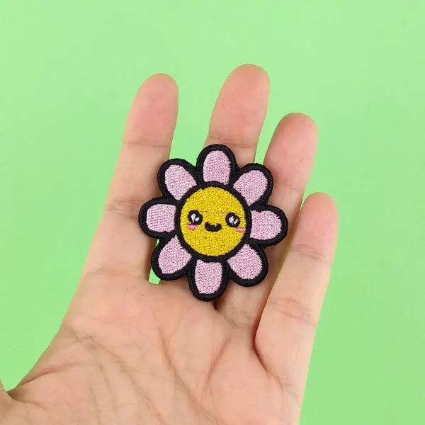 Kawaii Pink Flower Embroidered Patch on holding hand