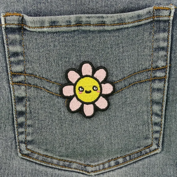 Kawaii Pink Flower Embroidered Patch on black jeans