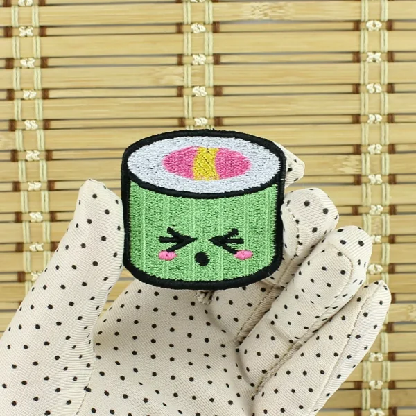 Green Kawaii Sushi Embroidered Patch on holding hand