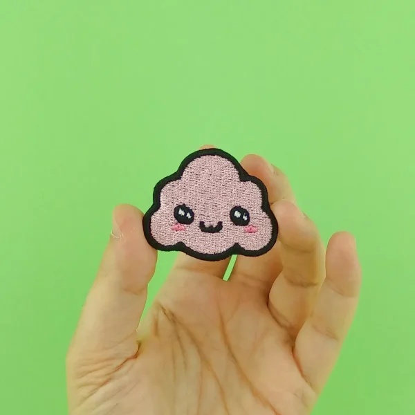 Pink Kawaii Cloud Embroidered Patch on holding hand