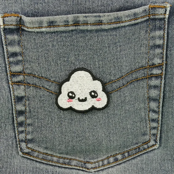 White Kawaii Cloud Embroidered Patch on black jeans