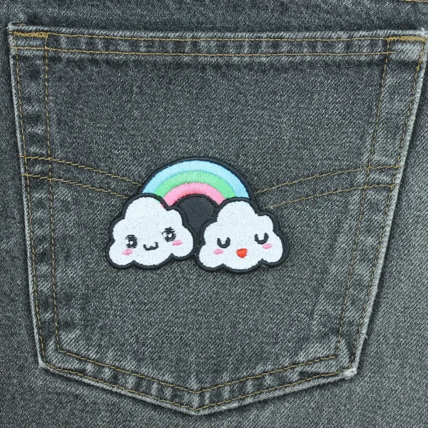 Kawaii Rainbow Clouds Embroidered Patch on black jeans