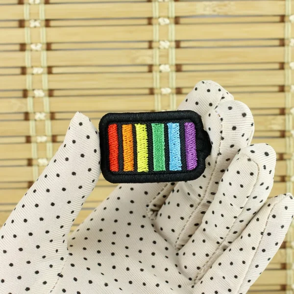 Rainbow Battery Embroidered Patch on holding hand