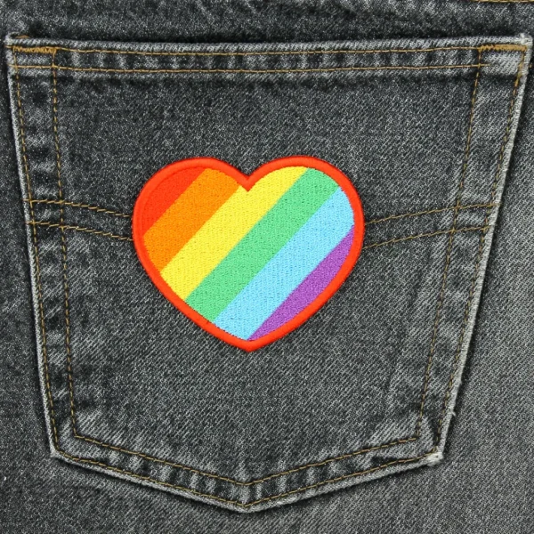 Rainbow Heart Embroidered Patch on Black Jeans