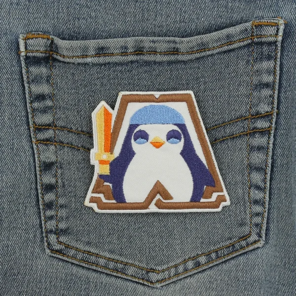 Penguin Knight Embroidered Patch TFT on black jeans