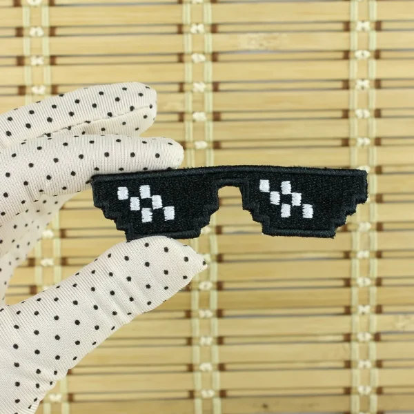 Black and white Pixelated Glasses Embroidered Patch on holding hand