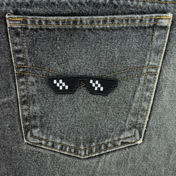 Black and white Pixelated Glasses Embroidered Patch on black jeans