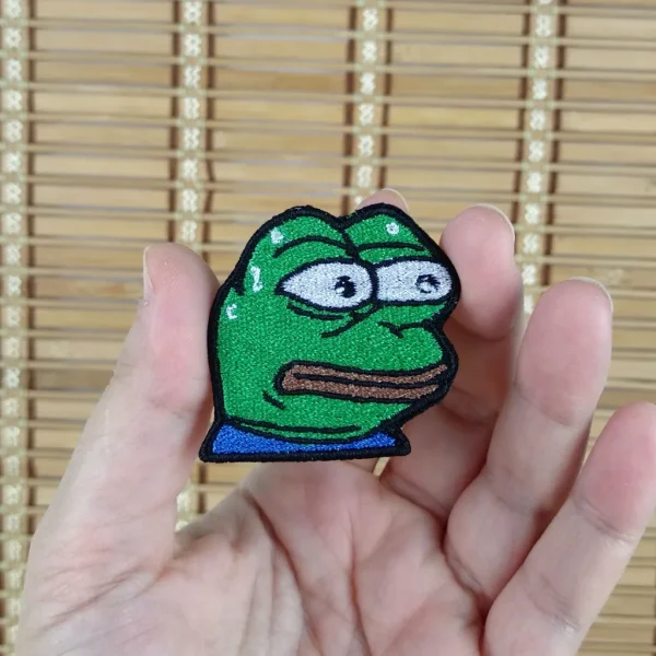 small pepe the frog stressed MonkaS Emote Embroidered Patch on holding hand