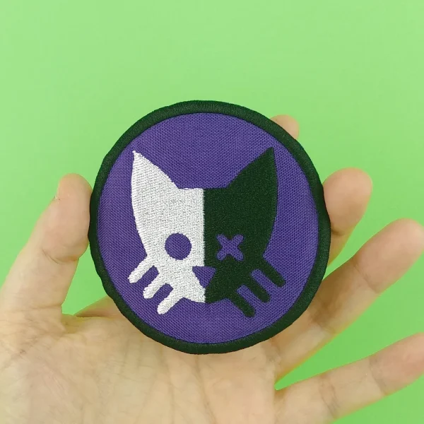 medium Purple Schrödinger Cat Embroidered Patch on holding hand