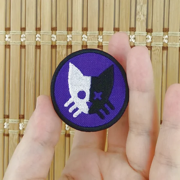 small Purple Schrödinger Cat Embroidered Patch on holding hand