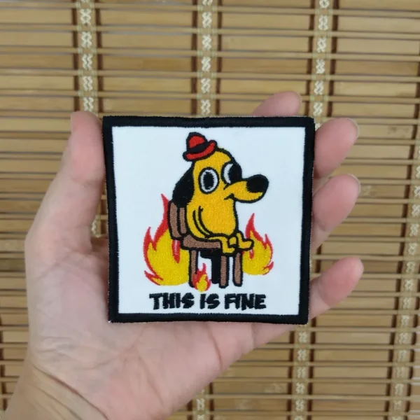 cartoon dog on fire This is Fine Embroidered Patch on holding hand