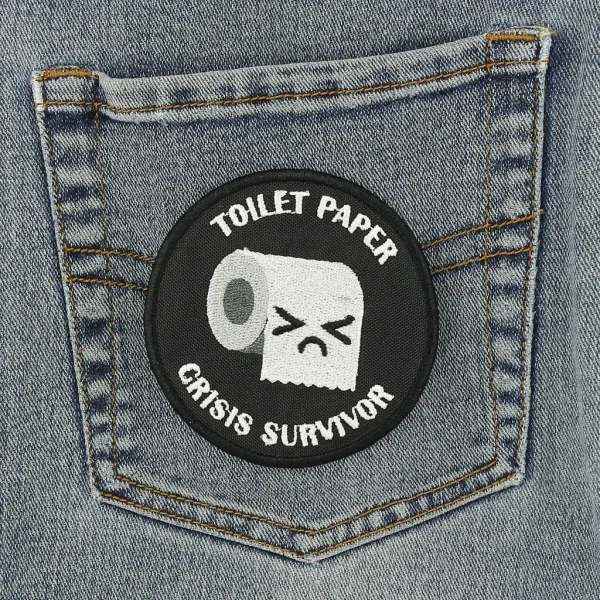 Toilet Paper Crisis Survivor Embroidered Patch on black jeans