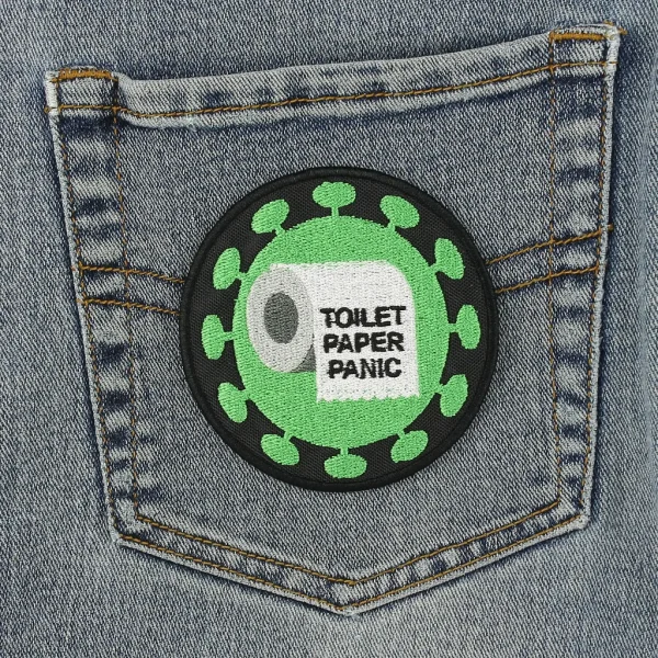 Toilet Paper Panic Embroidered Patch on black jeans