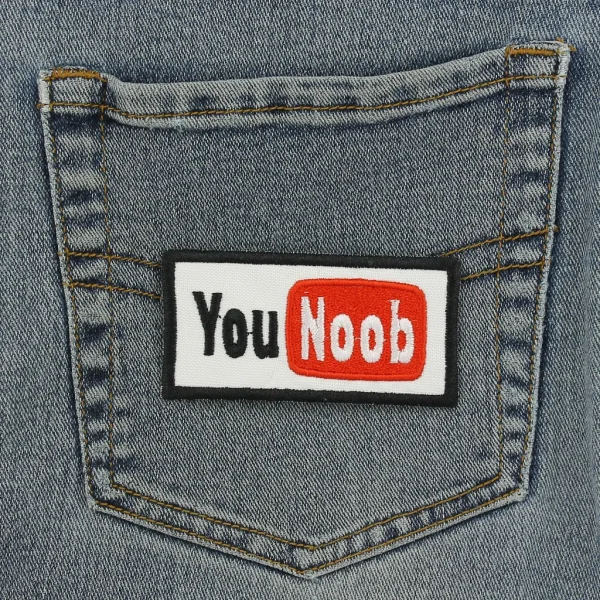 You Noob Embroidered Patch on black jeans