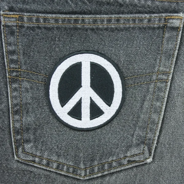 Medium Black and White eace Sign Embroidered Patch on black jeans