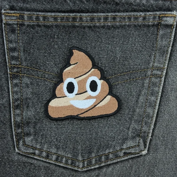 medium Smiling Cute Pile of Poo Embroidered Patch on black jeans