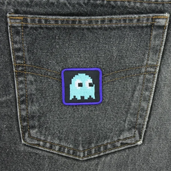 Blue Pixel Ghost Embroidered Patch on black jeans