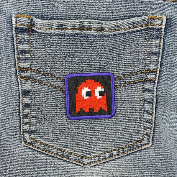 Red Pixel Ghost Embroidered Patch on black jeans