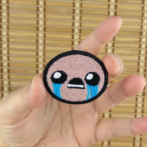 small Isaac BibleThump Twitch Emote Embroidered Patch on holding hand