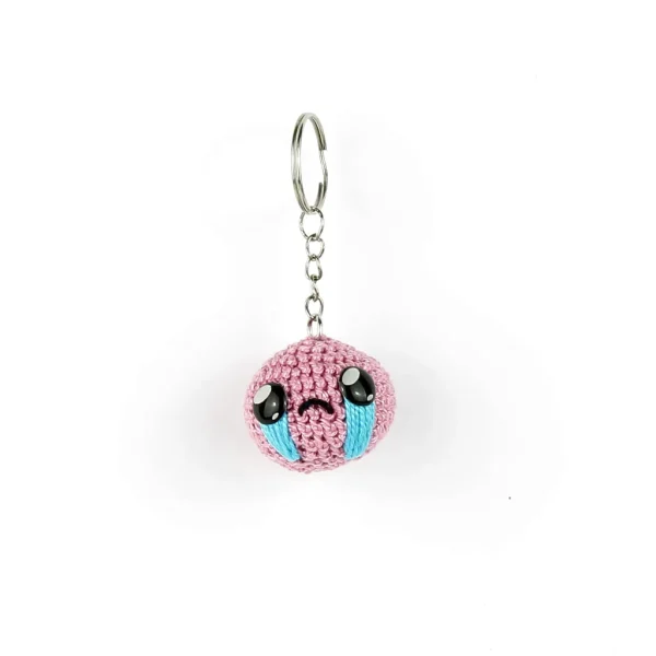 Binding of Isaac Head Keychain over white background