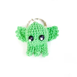 Kawaii Cthulhu Keychain over white background