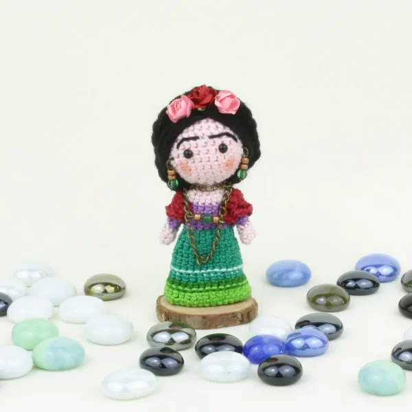 Mexican Doll Crochet Amigurumi next to pearl stones