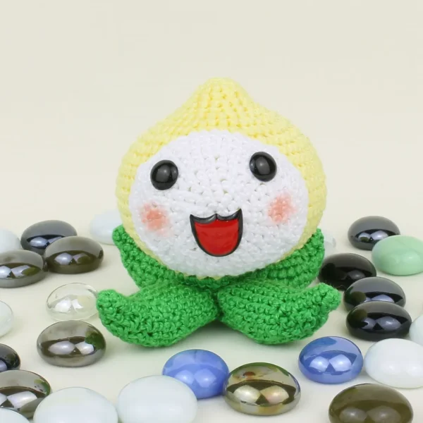 Pachimari Crochet Amigurumi Kawaii Onion next to pearl stones