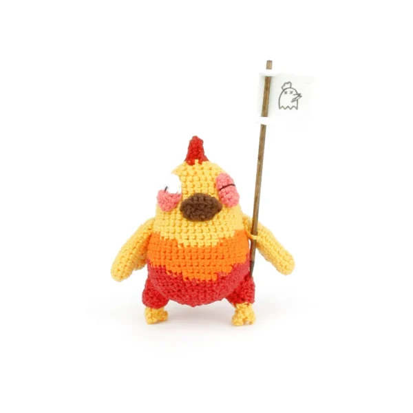 Orange Chicken Crochet Amigurumi holding a flag over white background